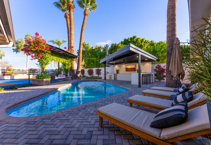 Villa Makena vacation home in Scottsdale with a heated pool, sun loungers and an outdoor bar pergola